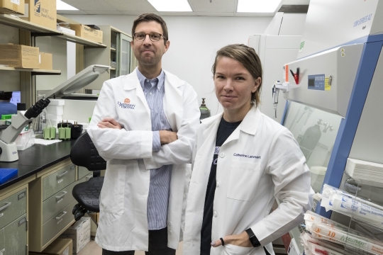 John Lukens, PhD, of UVA's Department of Neuroscience and its Center for Brain Immunology and Glia, in the lab with graduate student Catherine R. Lammert. They and their colleagues were responsible for the autism discovery.