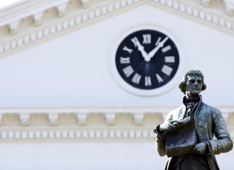 A statue of Thomas Jefferson in front of the Rotunda at the University of Virginia.