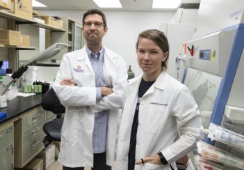 John Lukens, PhD, of UVA's Department of Neuroscience and its Center for Brain Immunology and Glia, in the lab with graduate student Catherine R. Lammert. They and their colleagues were responsible for the autism discovery.