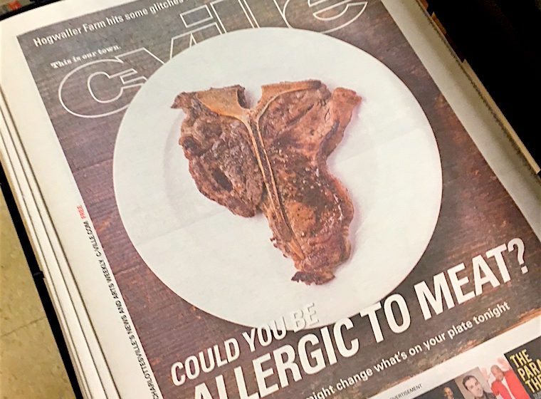 This is the cover of the C-Ville publication. It shows a juicy T-bone steak. The text reads 