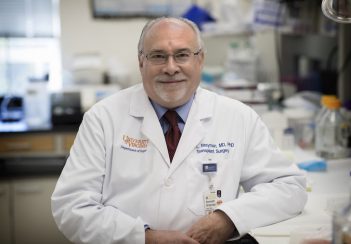 Transplant surgeon Kenneth Brayman sits in his lab.
