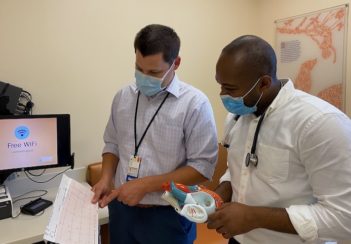 Dr. Peter Dean consults with Dr. Firezer Haregu.