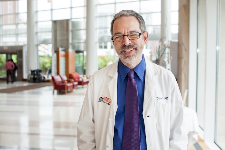 Dr. David Schiff stands in the UVA hospital lobby.
