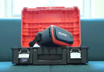 A virtual-reality headset sitting on a plastic storage box.