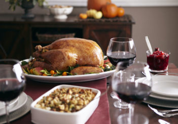 A Thanksgiving meal with turkey and wine