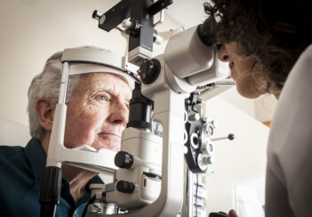 An optometrist conducts an eye exam.
