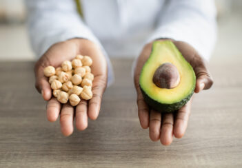 Nutritionist holds chickpeas and an avocado