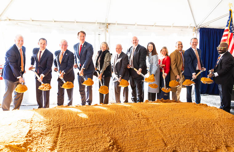 UVA and state leaders, as well as donor Paul Manning, hold shovels at the groundbreaking.