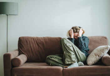 Woman suffering on a couch