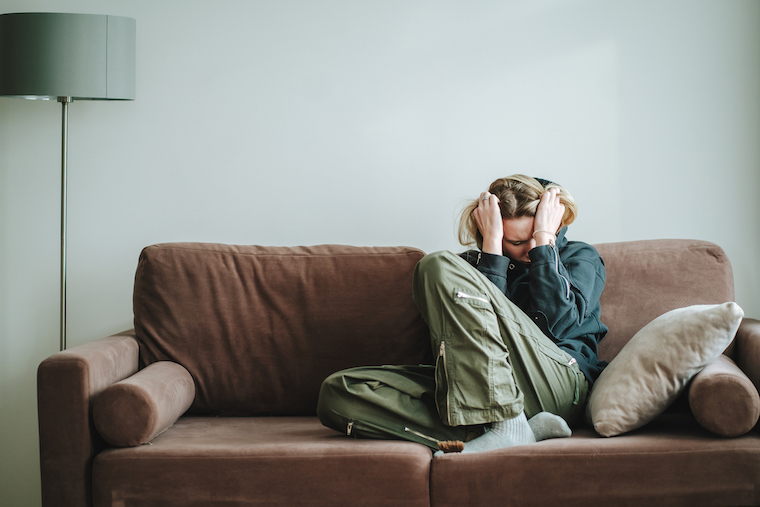 Woman suffering on a couch